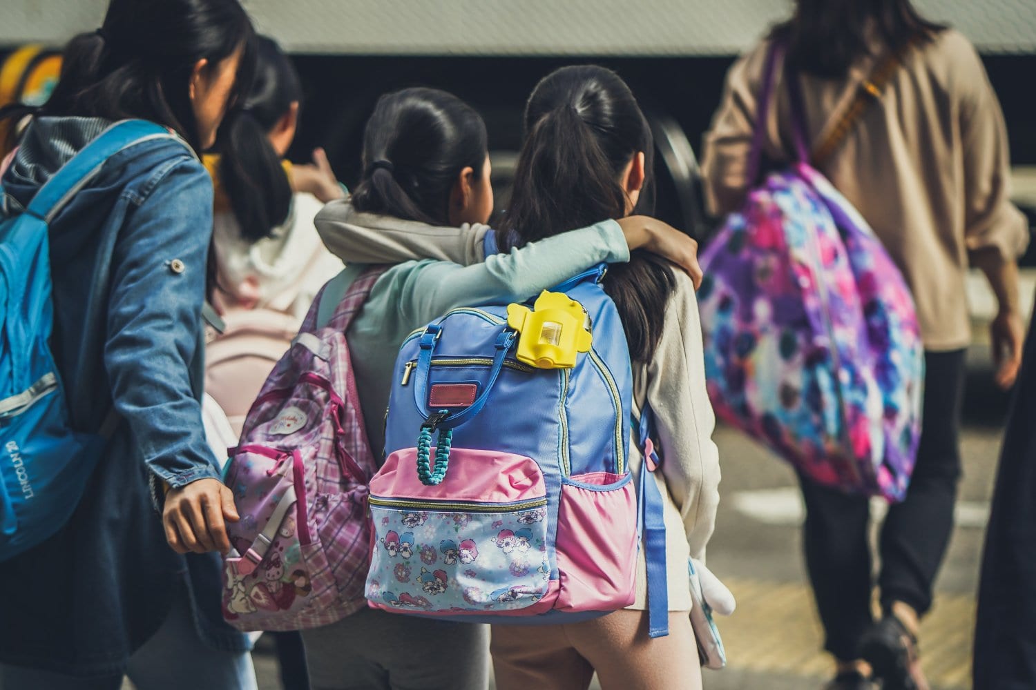 School kids walking, wearing backpacks