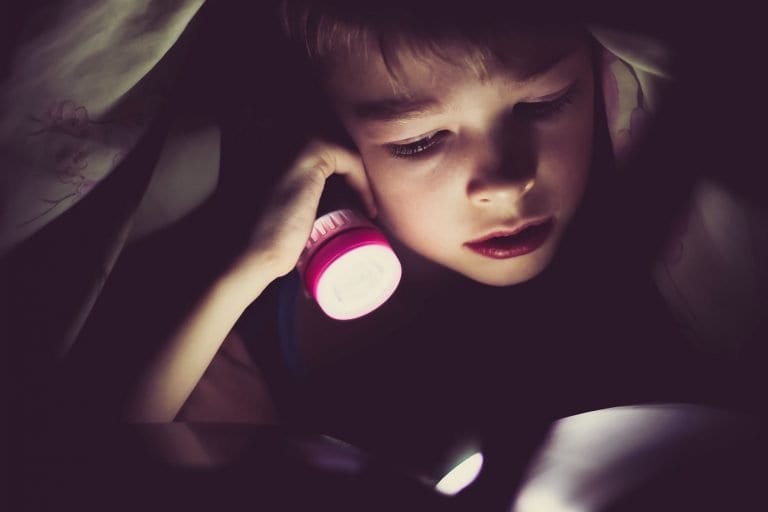 Child reading food allergy books for kids