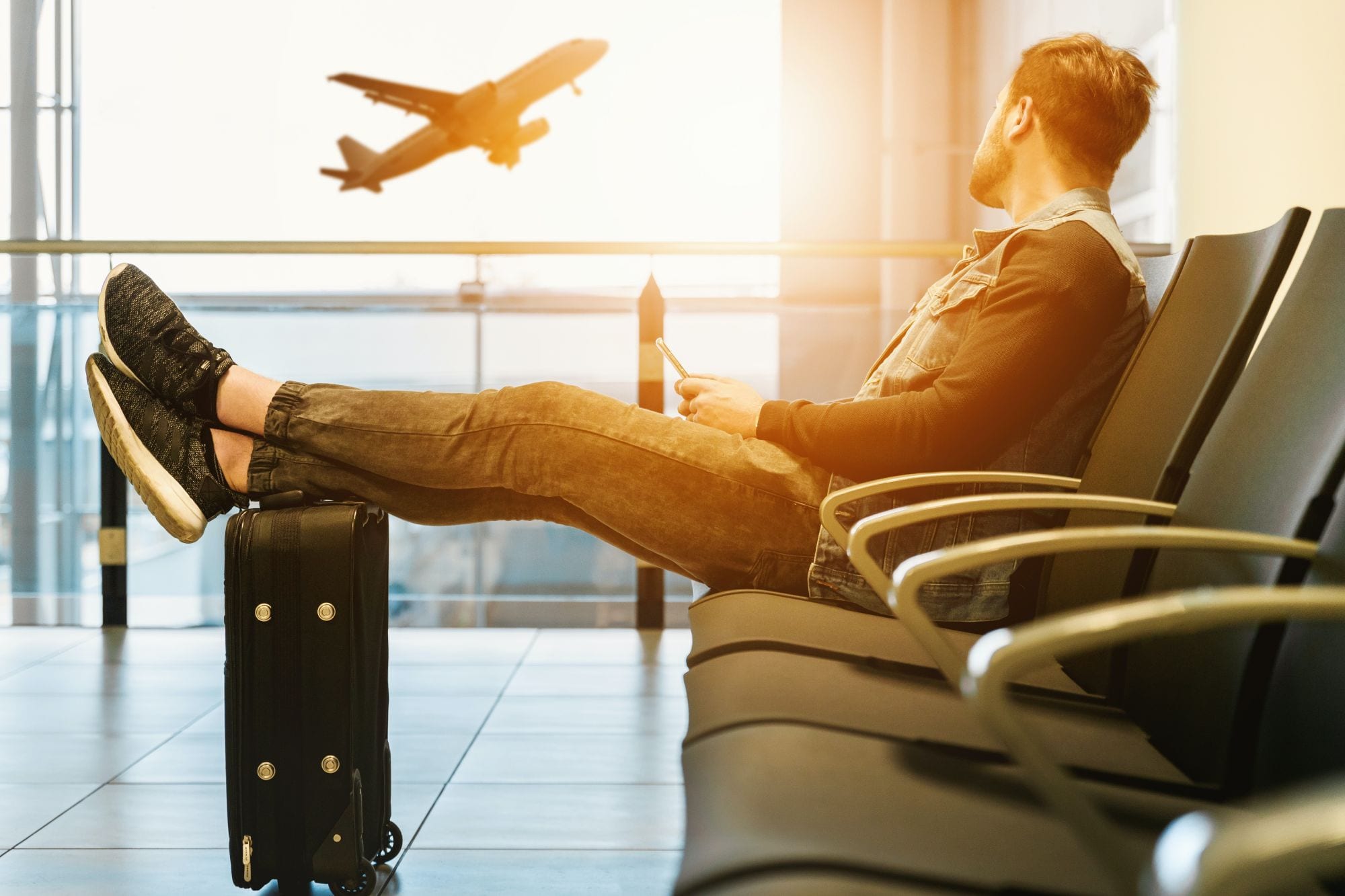 Man waiting to board airplane, for flying with a peanut allergy