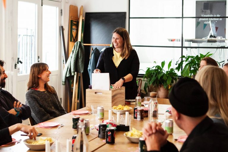 Coworkers opening gifts at office party; nut free gifts for office
