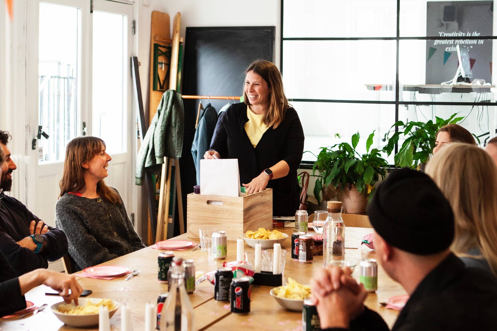 Coworkers opening gifts at office party; nut free gifts for office